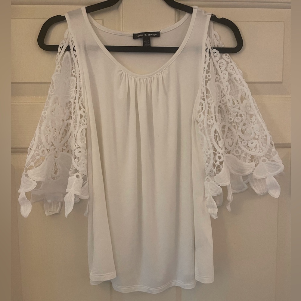 Cold Shoulder pullover top with beautiful cutout sleeves.Fabric-Viscose/Spandex